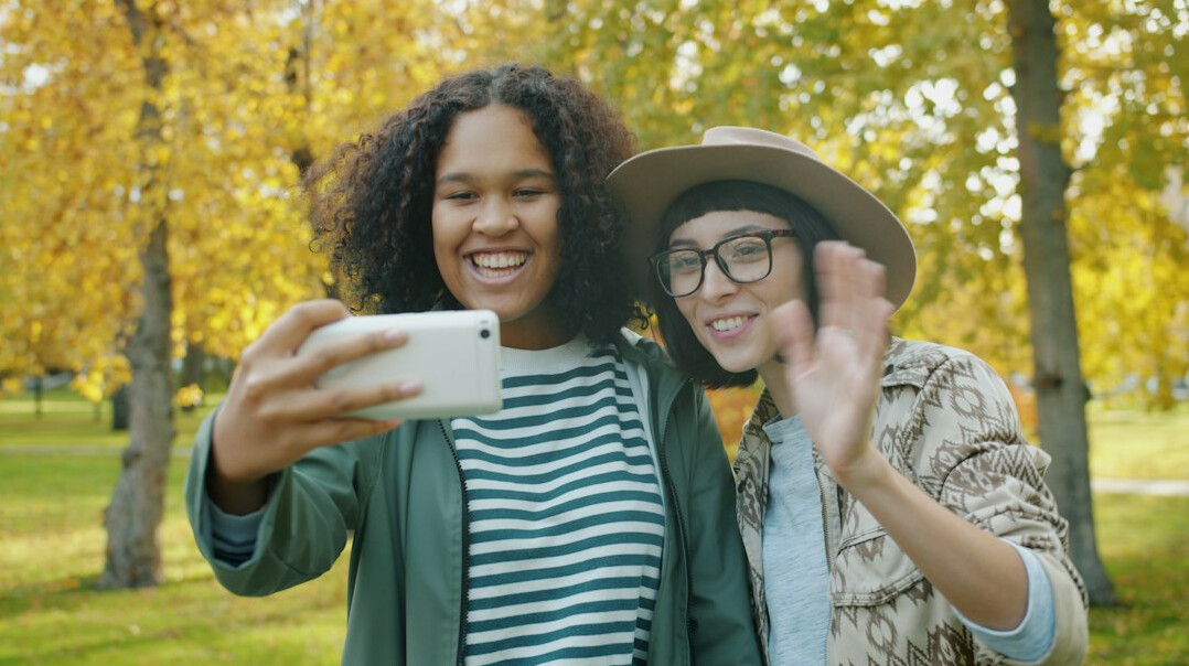 Friends laughing together outdoors